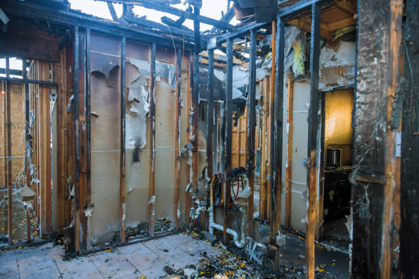 Professional Emergency Fire Damage Restoration technician working in Rogers, TX